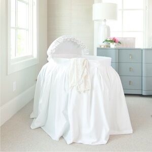 Beautiful white baby bassinet by Bratt Decor